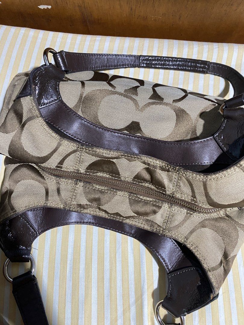 Coach Signature Hobo Shoulder Bag (Category: Shoulder Bags) located in Lapu Lapu. Submitted by yeldeclutters_ (Listing ID 1466201832, Image 3). Description: very minimal flaws, just small dirt at the bottom part 8.5 to 9/10 condition dm for details.