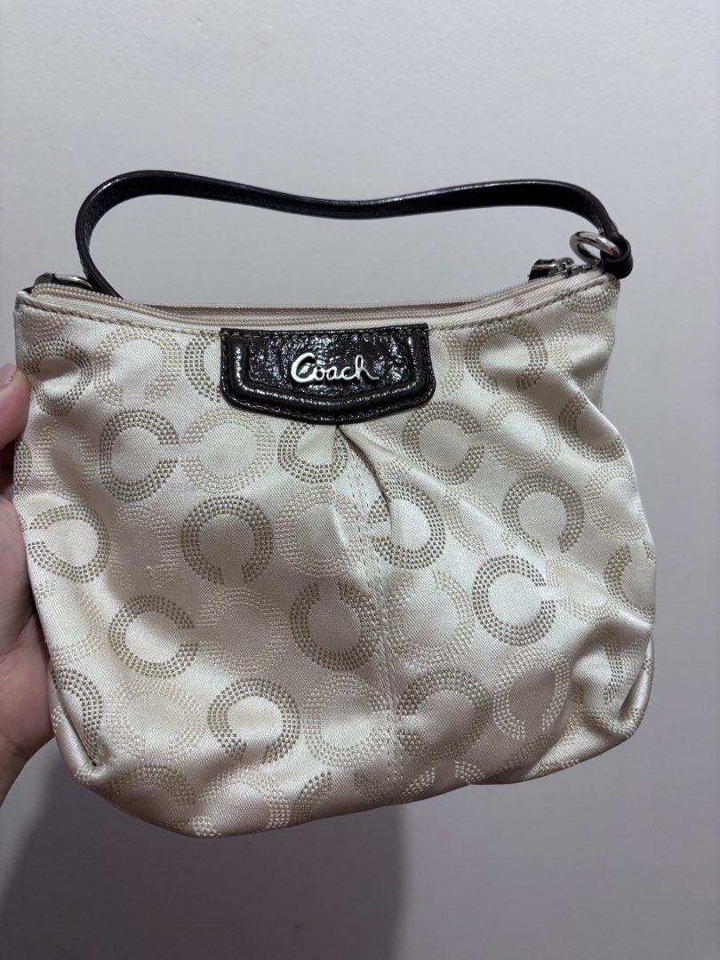 Coach Signature Optic C Small Hobo Bag (Category: Luxury Bags & Wallets) located in Caloocan City. Submitted by stuff_shop (Listing ID 1466293215, Image 1). Description: Coach monogram hobo bag in cream and beige fabric. Dark brown patent leather trim, strap, and Coach logo plaque on the front. Silver-tone hardware. Includes a detachable dark brown strap to wear as a shoulder bag or crossbody. Small Coach leather hangtag attached by a beaded chai