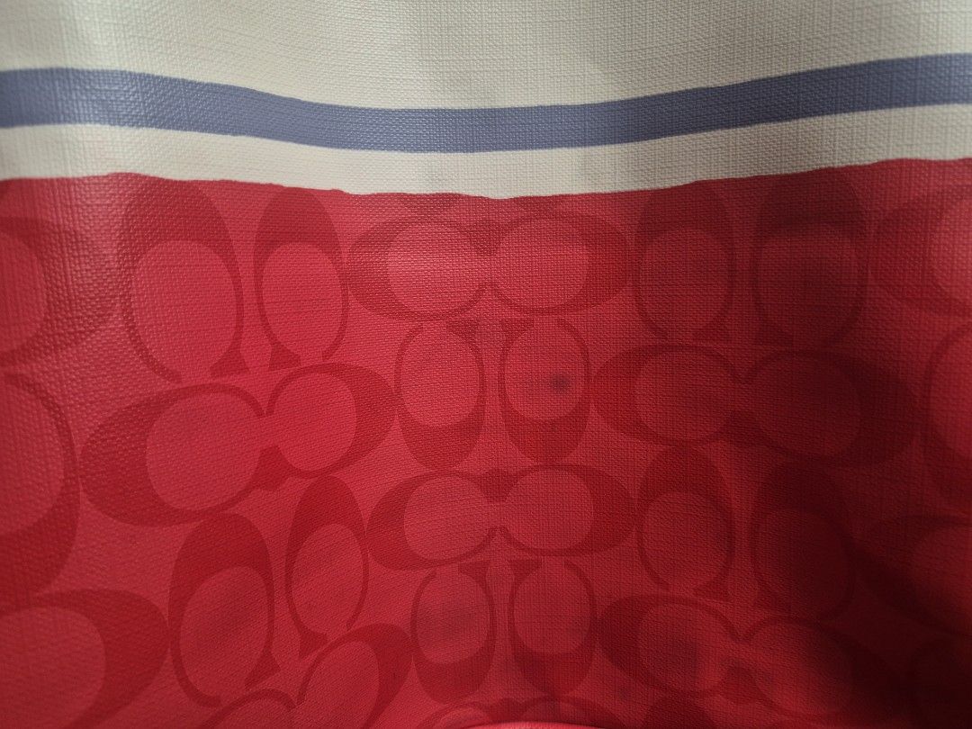 Coach Signature Stripe Tote Bag (Category: Luxury Bags & Wallets) located in Quezon City. Submitted by namibagz_ph (Listing ID 1458799797, Image 2). Description: - Authentic Coach tote bag - Eye-catching red, white, and blue signature stripe design - Genuine leather handles and trim for a premium feel - Includes iconic Coach hang tag - Spacious interior, ideal for everyday use With color transfer and signs of usage.
