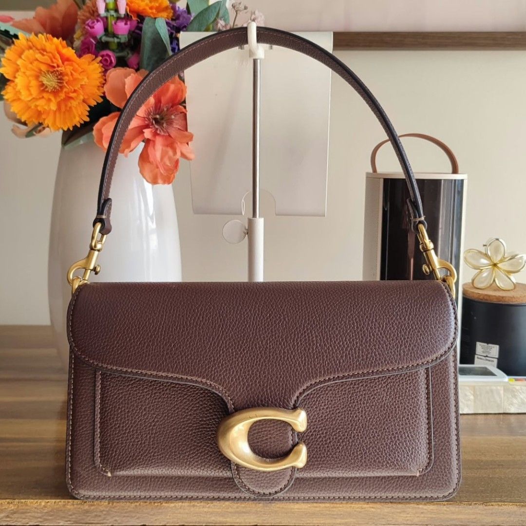 Coach Tabby 26 in Brown (Category: Luxury Bags & Wallets) located in Baguio. Submitted by zozo.collections (Listing ID 1466164372, Image 1). Description: Coach Tabby 26 in Brown, 2025 release Bought October last year A second strap comes with the bag. Strap is adjustable and may be used as cross-body. Perfect and almost unused condition. Coach full grain leather Heavy brass classic C hardware, Strap has no damages too. No damages to the leather, 