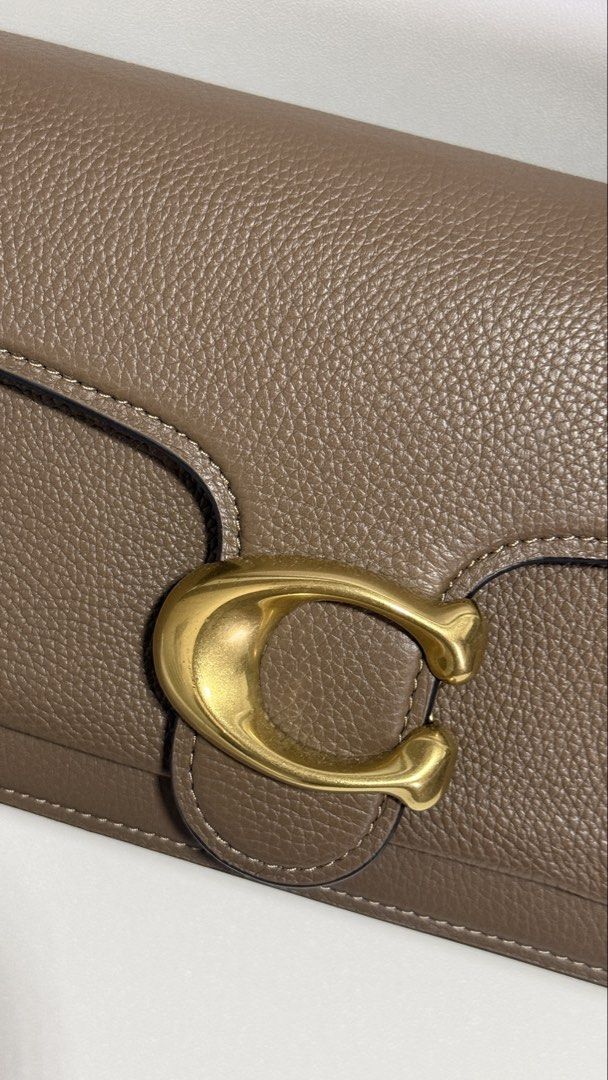 COACH TABBY SHOULDER BAG 26 – DARK STONE (Category: Luxury Bags & Wallets) located in Paranaque City. Submitted by j.tricianicoleanne (Listing ID 1466187351, Image 3). Description: Selling my Coach Tabby 26 in Brass/Dark Stone 🤎 ✨ Like New / Excellent Condition Very well kept and in beautiful condition. • Authentic Coach • Color: Brass/Dark Stone • Polished pebble leather • Signature Coach “C” hardware • Detachable short shoulder strap • Detacha
