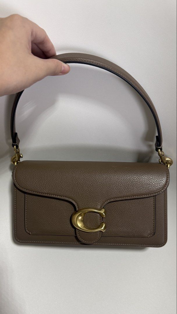 COACH TABBY SHOULDER BAG 26 – DARK STONE (Category: Luxury Bags & Wallets) located in Paranaque City. Submitted by j.tricianicoleanne (Listing ID 1466187351, Image 2). Description: Selling my Coach Tabby 26 in Brass/Dark Stone 🤎 ✨ Like New / Excellent Condition Very well kept and in beautiful condition. • Authentic Coach • Color: Brass/Dark Stone • Polished pebble leather • Signature Coach “C” hardware • Detachable short shoulder strap • Detacha