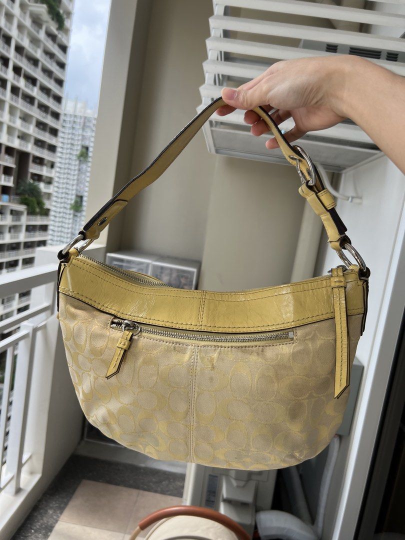 Coach Yellow Soho Hobo Bag (Category: Shoulder Bags) located in Manila. Submitted by declutter_gurl (Listing ID 1466198401, Image 1). Description: Medium size hobo bag Loc: Pasig.