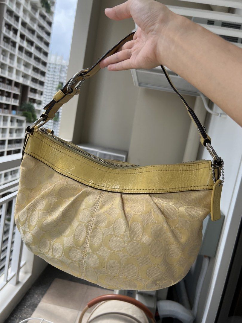 Coach Yellow Soho Hobo Bag (Category: Shoulder Bags) located in Manila. Submitted by declutter_gurl (Listing ID 1466198401, Image 2). Description: Medium size hobo bag Loc: Pasig.