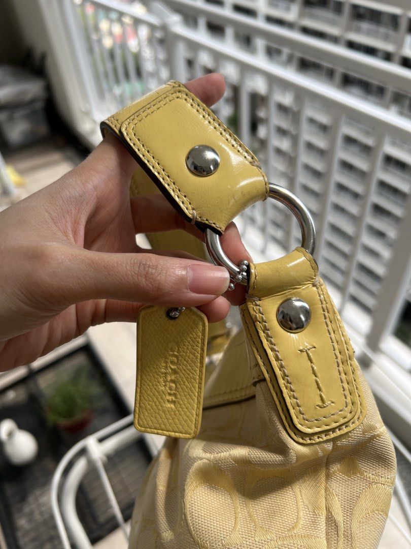 Coach Yellow Soho Hobo Bag (Category: Shoulder Bags) located in Manila. Submitted by declutter_gurl (Listing ID 1466198401, Image 3). Description: Medium size hobo bag Loc: Pasig.