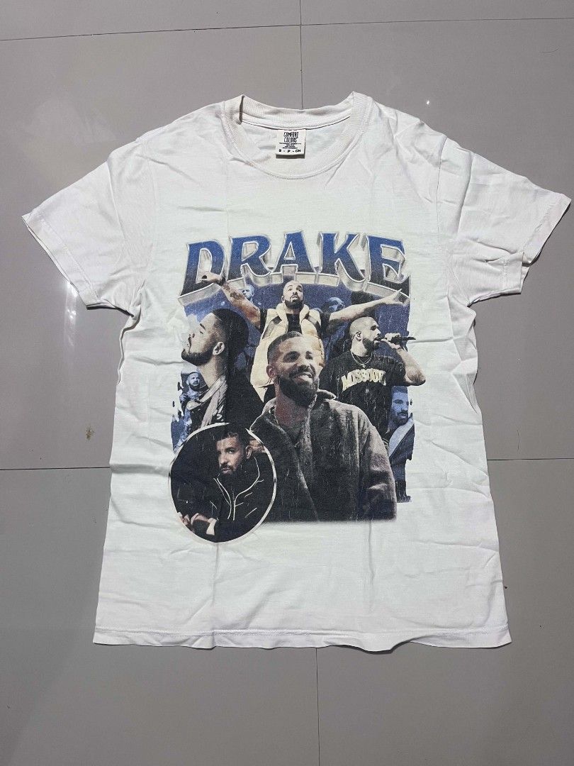 Comfort Colors Drake Rap Tee Size S (Category: Tshirts & Polo Shirts ) located in Valencia. Submitted by mahartinmo19925 (Listing ID 1466285283, Image 1). Description: - Brand: Comfort Colors - Design: Drake graphic print with bold blue lettering - Size: Small (Tag size S, made in Honduras) - Material: Heavyweight ring-spun cotton blank - Fit/Style: Classic crew neck, short sleeves, casual everyday wear.