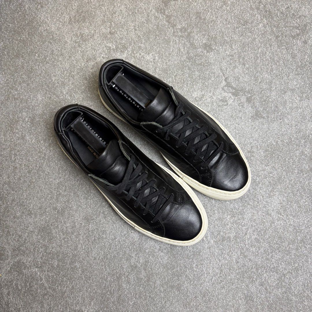 Common Projects Original Achilles Low Black Size 37 (Category: Sneakers) located in Cagayan de Oro. Submitted by taramattsa45690 (Listing ID 1466157767, Image 2). Description: Black leather low-top sneakers from Common Projects. Classic minimalist design with tonal laces and a contrasting white rubber sole. Gold serial number stamped on the heel counter. Leather upper and lining. Regular signs of wear on the soles and midsoles, uppers are clean a