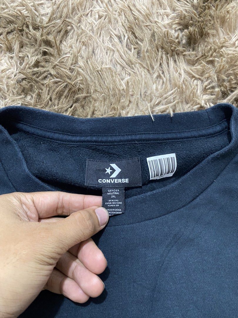 Converse Gender Neutral 2XL Sweatshirt Black (Category: Coats, Jackets and Outerwear) located in Cagayan de Oro. Submitted by sepamorash53558 (Listing ID 1466328844, Image 3). Description: - Brand: Converse - Color: Black with embroidered chest logo - Size: 2XL (Measurements: 27" x 30") - Material: 80% cotton, 20% polyester body; 98% cotton, 2% spandex ribbing - Condition/Features: Soft fleece lining, gender-neutral design, comfortable for layeri