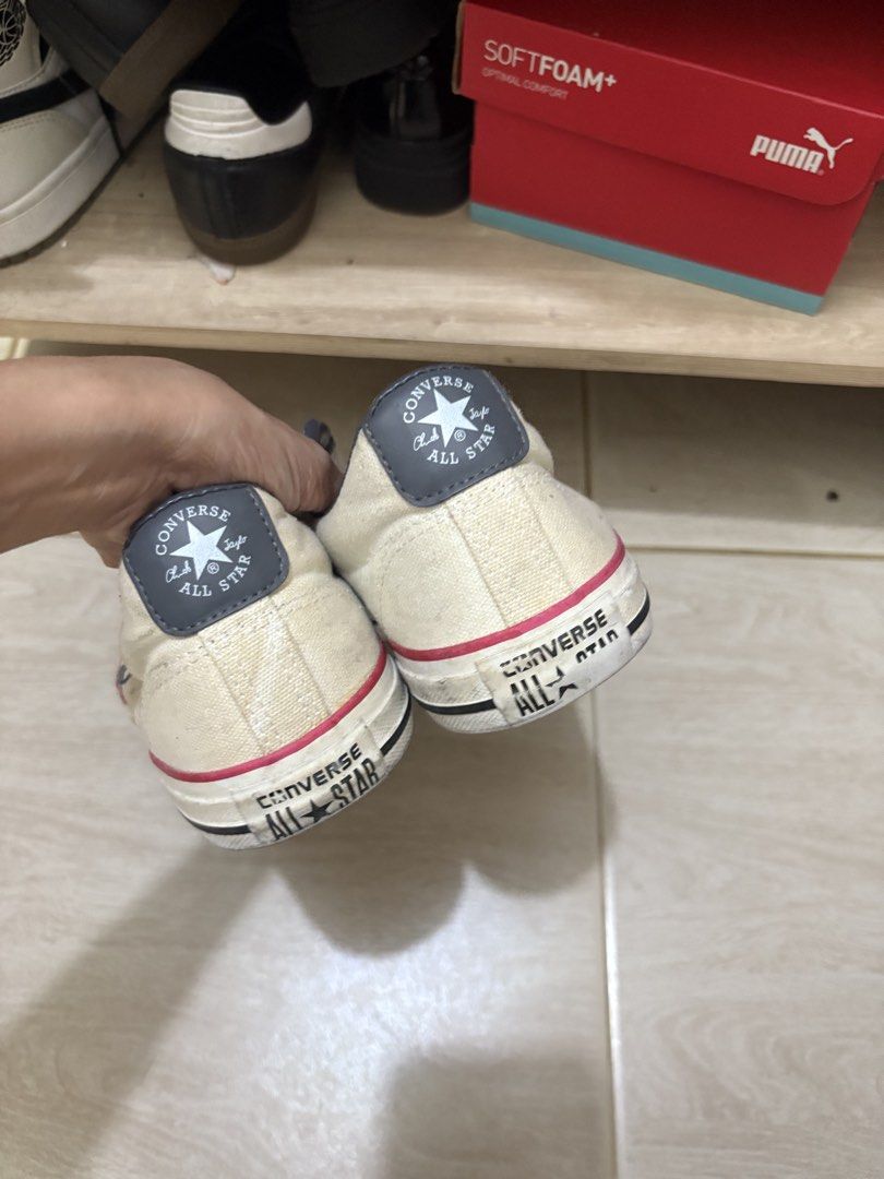 Converse Star Chevron Off-White Sneakers (Category: Sneakers) located in Mandaluyong City. Submitted by shopwithjuu (Listing ID 1466200389, Image 3). Description: Pre-loved off-white Converse canvas sneakers featuring the iconic dark grey star and chevron logo, with striking red and black midsole piping and ankle padding. Shows regular overall wear on the canvas and midsoles, and please note that laces are not included. Grab these classic kicks t