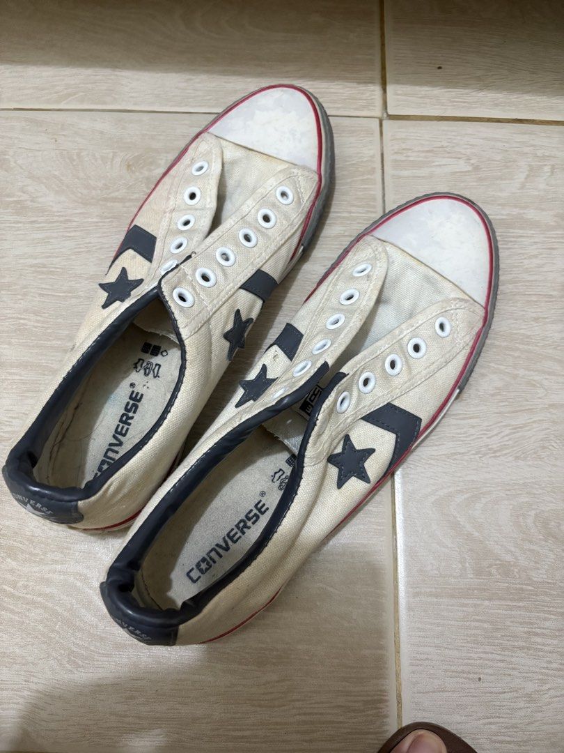 Converse Star Chevron Off-White Sneakers (Category: Sneakers) located in Mandaluyong City. Submitted by shopwithjuu (Listing ID 1466200389, Image 1). Description: Pre-loved off-white Converse canvas sneakers featuring the iconic dark grey star and chevron logo, with striking red and black midsole piping and ankle padding. Shows regular overall wear on the canvas and midsoles, and please note that laces are not included. Grab these classic kicks t