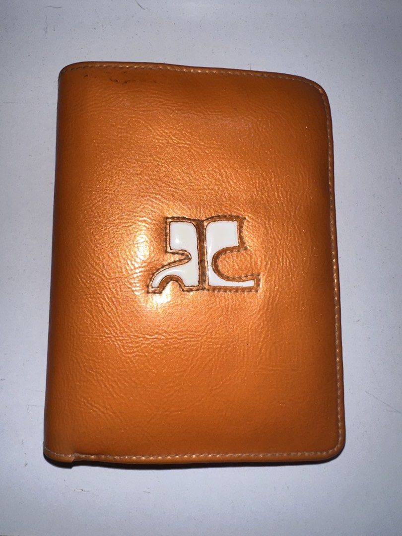 Courreges Vinyl Wallet (Category: Luxury Bags & Wallets) located in Davao. Submitted by buygenius (Listing ID 1466313293, Image 2). Description: • This vinyl Courreges wallet has 7 card slots, a coin purse, a slot for photos, and lots of slip pockets for receipts and other ephemera! The bill compartment is also divided into two sections in case you want to separate some bills. Color is even more eye-catching and playful IRL! • Flaws: due to the v