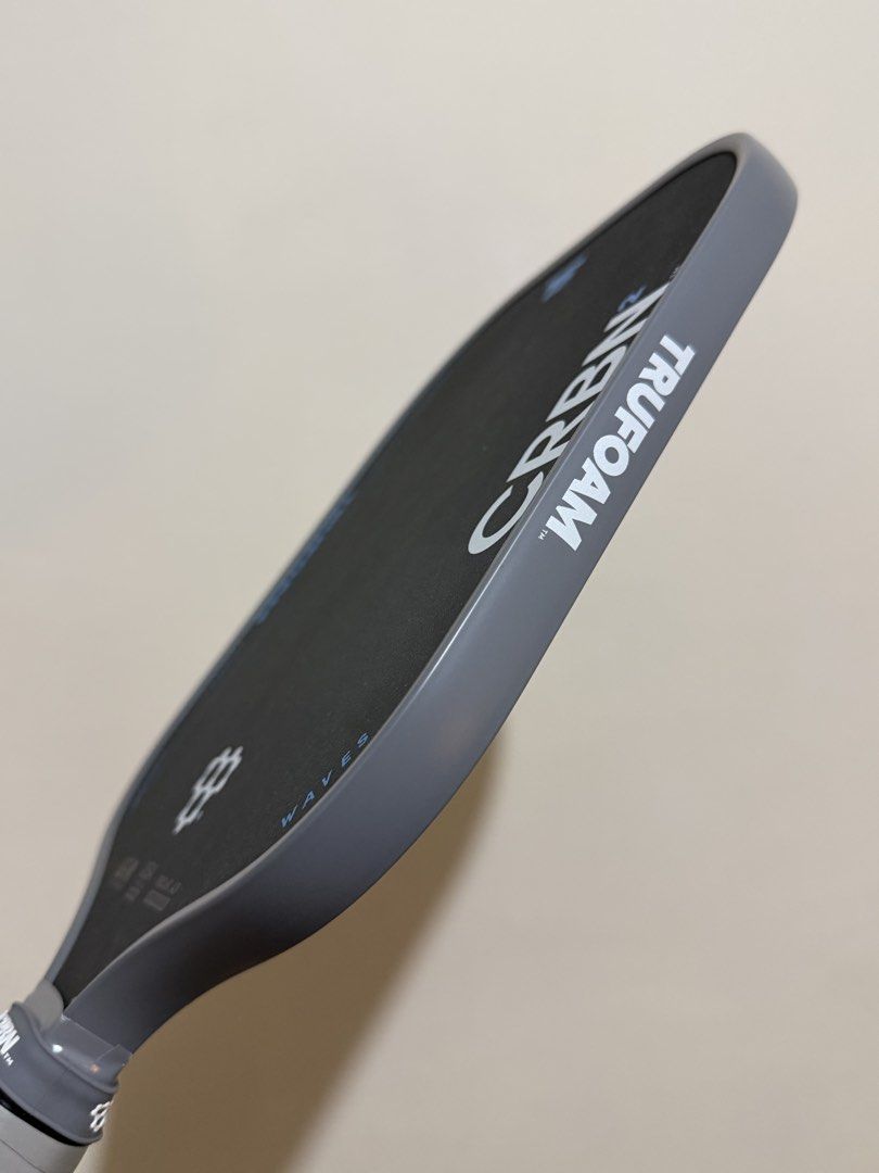 CRBN TRUFOAM Waves Pickleball Paddle (Category: Racket and Ball Sports) located in Las Pinas. Submitted by 2580cart (Listing ID 1466289619, Image 2). Description: - Model: CRBN2 TRUFOAM Waves pickleball paddle - Condition: Flawless, zero scuffs on the carbon face - Edge Guard: Completely clean all around - Extras: Includes original branded protective cover sleeve and wrapped grip handle Bought last February 2026.