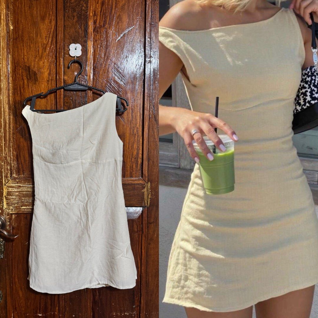 Cream Asymmetrical Off-Shoulder Mini Dress (Category: Dresses) located in Kananga. Submitted by yongggi (Listing ID 1466320234, Image 1). Description: Cream colored mini dress with an asymmetrical neckline. Fitted body with short length. ‼️Free Shipping.