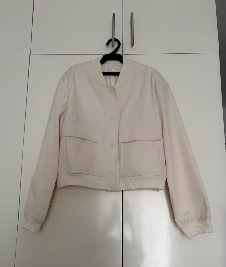 Cream Bomber Jacket with Front Pockets Size S (Category: Coats, Jackets and Outerwear) located in Las Pinas. Submitted by sabs28 (Listing ID 1466237282, Image 1). Description: Features a button-up front, two large chest pockets, and ribbed details. 100% polyester. .