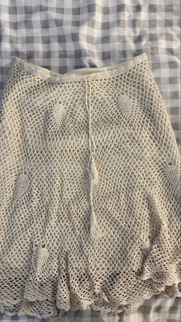 Cream Crochet Knit Skirt with Lining and Drawstring (Category: Skirts) located in Muntinlupa City. Submitted by addielejano (Listing ID 1466266967, Image 3). Description: Cream crochet knit skirt. Fully lined underneath so it's not see-through. Open mesh pattern with solid pineapple motifs scattered throughout. Scalloped hem at the bottom. Drawstring waist with tassel ends. Midi length, flowy fit. fits M-L.