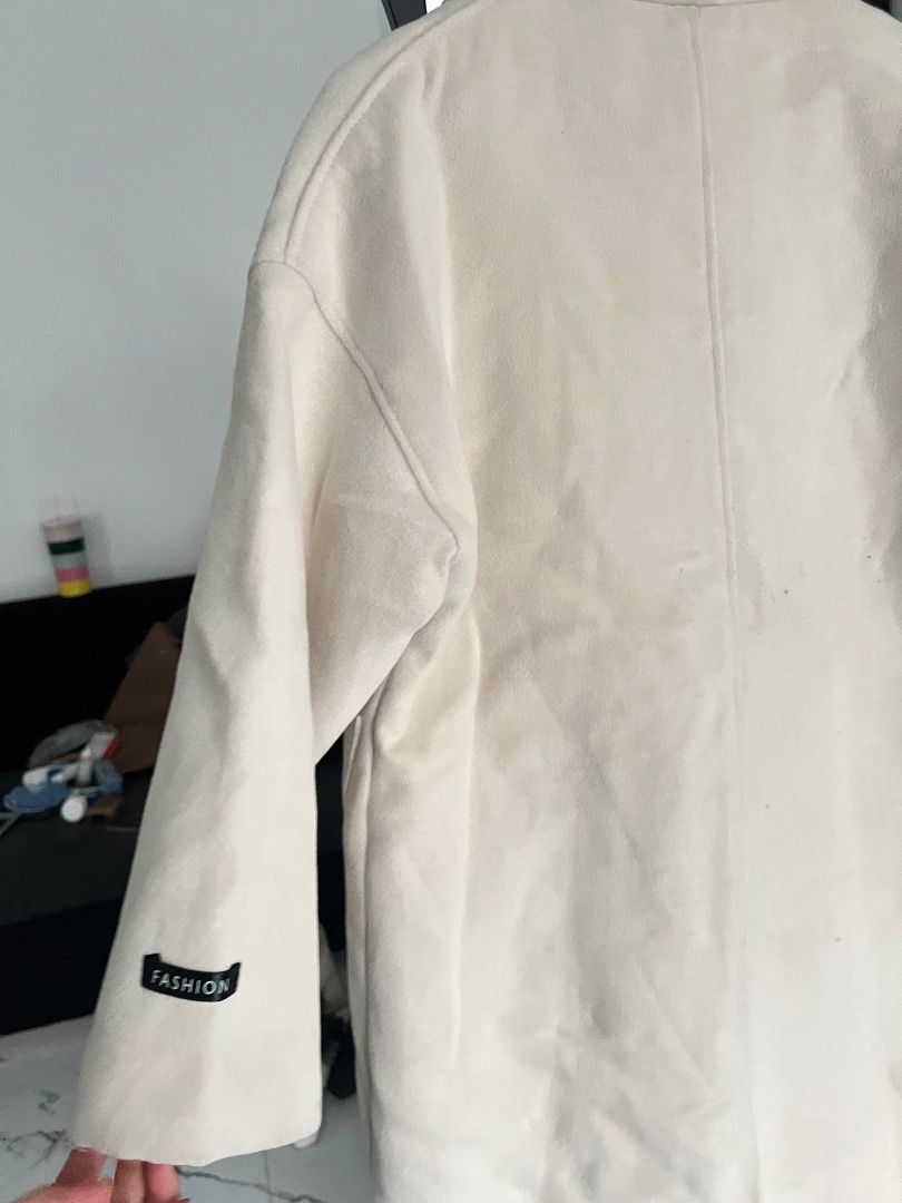 Cream Quilted Lined Long Trench Coat wool Outerwear (Category: Coats, Jackets and Outerwear) located in Baguio. Submitted by pureearth.5f1c08 (Listing ID 1466228543, Image 3). Description: - Color: Cream / Neutral Beige -size: Small-Large - Style: Long coat with snap button front closure - Warmth: Quilted interior lining for extra warmth - Storage: Two functional front pockets - Detail: Small black label on the right sleeve cuff - Condition: Exce