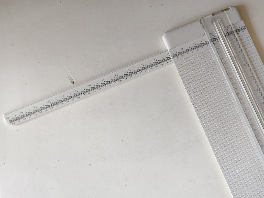Cricut Portable Trimmer (Category: Craft Supplies & Tools) located in Paranaque City. Submitted by shopcadescloset (Listing ID 1466213075, Image 3). Description: Blades can be replaced if available in stores. Cricut paper trimmer for crafting and scrapbooking. Includes a swing-out arm measuring up to 16 inches for larger cardstock and paper sheets. Grid lines printed on the base surface help align cuts accurately. Sliding blade mechanism cuts str