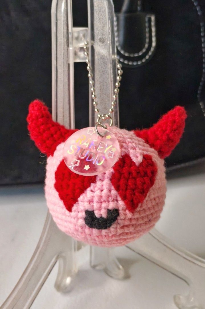 Crochet Heart-Eye Devil Keychain (Original Design) 😈❤️ (Category: Handmade Craft) located in Quezon, Isabela. Submitted by youarerareyou (Listing ID 1466224155, Image 2). Description: Price: ₱350 Condition: Brand New / 100% Handmade Availability: Made-to-order (DM for current slots!) Add a little bit of spooky sweetness to your bags or keys! This adorable heart-eye devil plush keychain is meticulously crafted by hand using an advanced tapestry c