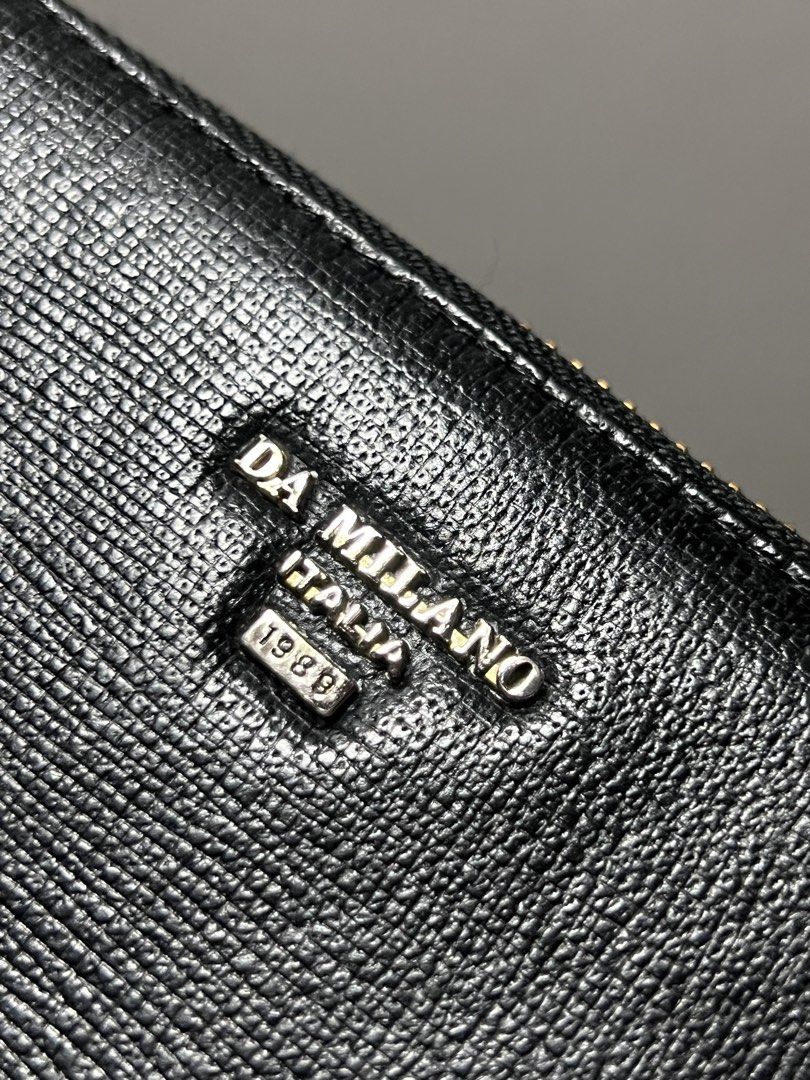 Da Milano leather wallet long (Category: Wallets & Card holders) located in Manila. Submitted by gee0505 (Listing ID 1466234147, Image 2). Description: never been used na stock lang :) Overall excellent condition. As is black color rate 10/10 Srp: 4k.