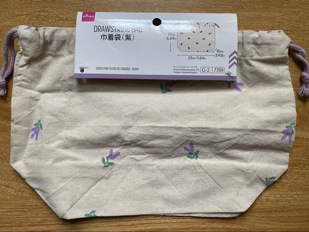 Daiso® Purple Floral Linen Drawstring Pouch (Category: Backpacks) located in Cainta. Submitted by stuff_4_sale_dump (Listing ID 1466201702, Image 3). Description: - original tag attached - 25cm W x 17cm H - for organizing makeup, accessories, or travel essentials.