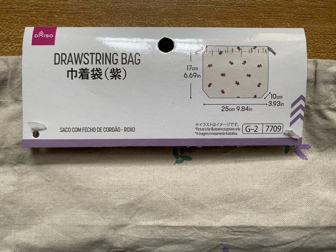Daiso® Purple Floral Linen Drawstring Pouch (Category: Backpacks) located in Cainta. Submitted by stuff_4_sale_dump (Listing ID 1466201702, Image 1). Description: - original tag attached - 25cm W x 17cm H - for organizing makeup, accessories, or travel essentials.
