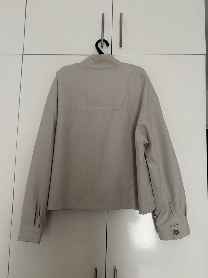 Dazy Beige Jacket Size L (Category: Coats, Jackets and Outerwear) located in Las Pinas. Submitted by sabs28 (Listing ID 1466235970, Image 3). Description: Features a button-up front, high collar, chest pockets, and adjustable drawstring hem..