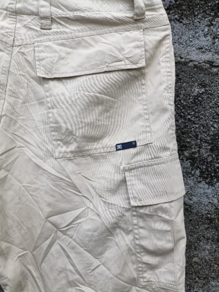DC Shoes Beige Cargo Shorts Size 30 (Category: Shorts) located in Aloran. Submitted by shangzr (Listing ID 1466280552, Image 3). Description: - Brand: DC Shoes - Size: 30 waist - Color: Classic beige - Material: Durable cotton fabric - Closure: Button fly - Features: Multiple utility pockets on sides and back - Style: Casual skate wear, great for everyday use.
