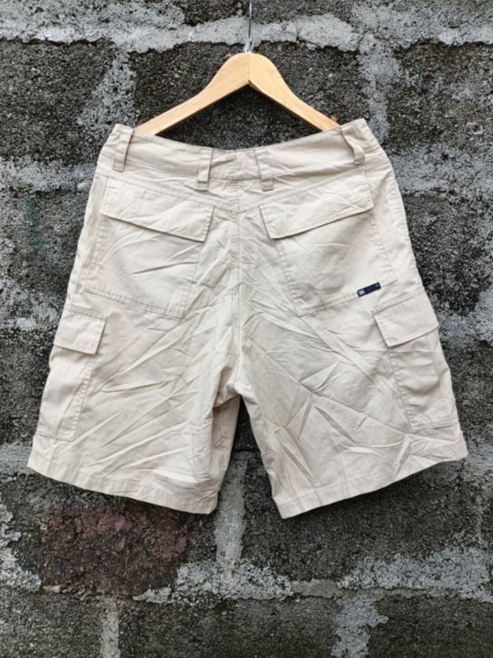 DC Shoes Beige Cargo Shorts Size 30 (Category: Shorts) located in Aloran. Submitted by shangzr (Listing ID 1466280552, Image 2). Description: - Brand: DC Shoes - Size: 30 waist - Color: Classic beige - Material: Durable cotton fabric - Closure: Button fly - Features: Multiple utility pockets on sides and back - Style: Casual skate wear, great for everyday use.