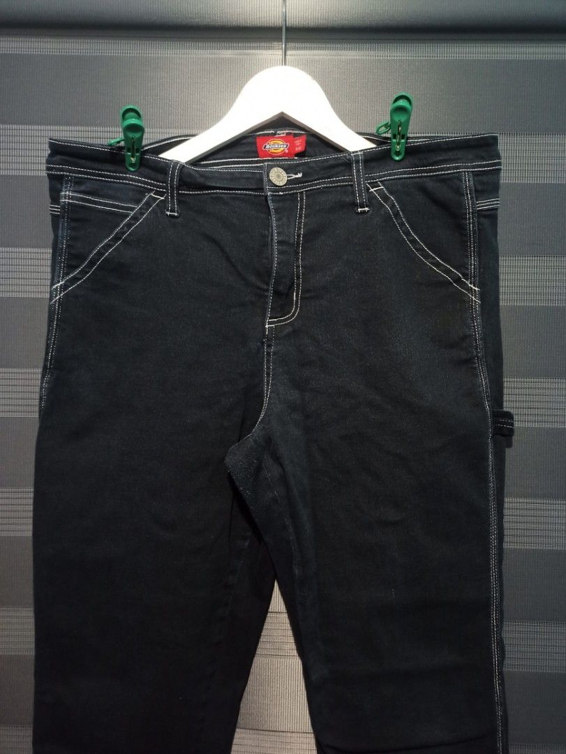 Dickies Black Denim Carpenter Pants (Category: Jeans) located in Manila. Submitted by thecomftrift.co (Listing ID 1466325344, Image 1). Description: - Brand: Dickies - Style: Dark denim carpenter pants with utility pockets and hammer loop - Details: Contrast white stitching, button closure, and red logo patch on back pocket - Material: Sturdy, durable denim - Condition: Great quality workwear staple.