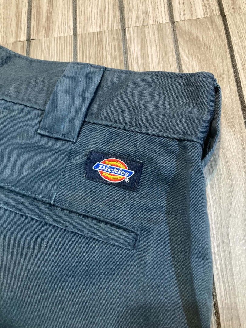 Dickies Dark Grey Work Shorts (Category: Shorts) located in Trece Martires City. Submitted by djaothriftshop (Listing ID 1466259177, Image 2). Description: - Brand/Model: Dickies Utility Shorts - Color: Dark Grey - Style: Classic skate and workwear - Material: Sturdy, durable twill fabric - Closure: Zip fly with hook and bar closure - Pockets: Back welt pockets (one with button closure and Dickies logo patch) - Details: Branded inner waistband li