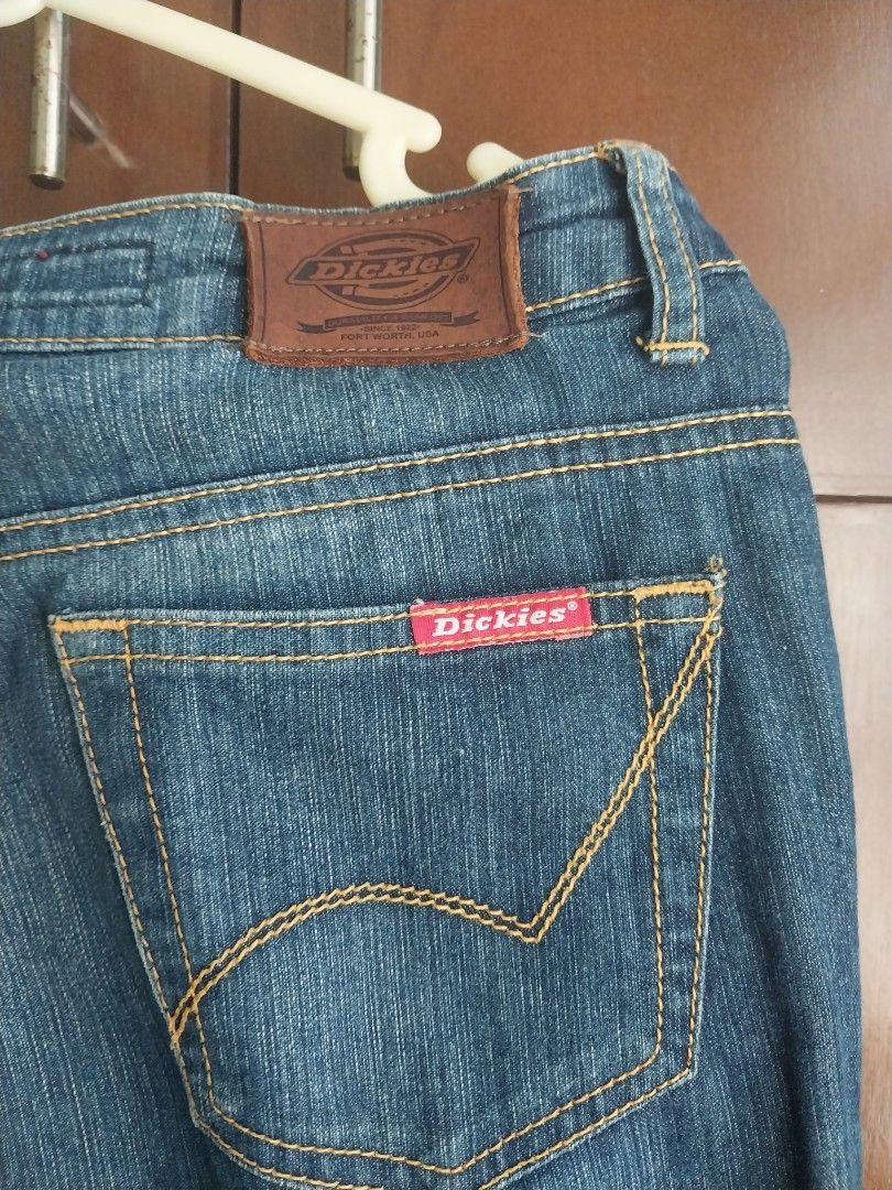 Dickies denim jeans size 26 (Category: Jeans) located in Aroroy. Submitted by imeea (Listing ID 1466158870, Image 3). Description: - Brand: Dickies - Style: Straight fit denim jeans - Color: Medium blue wash with contrast orange stitching - Material: 100% cotton - Details: Leather brand patch and signature red logo tag - Size: Tag size 26.