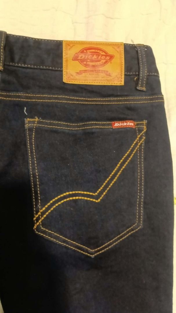 Dickies Indigo Jeans Size 32 PJP 821 (Category: Jeans) located in Caloocan City. Submitted by silverbird_6c038f (Listing ID 1466285078, Image 2). Description: - Brand: Dickies - Style Number: DSL5U PJP 821 - Color: Dark indigo wash - Size: 32 waist (81 cm measurement) - Material: 78% cotton, 20% polyester, 2% polyurethane blend with slight stretch - Design: Classic five-pocket style with contrast gold stitching - Details: Leather patch on back wa