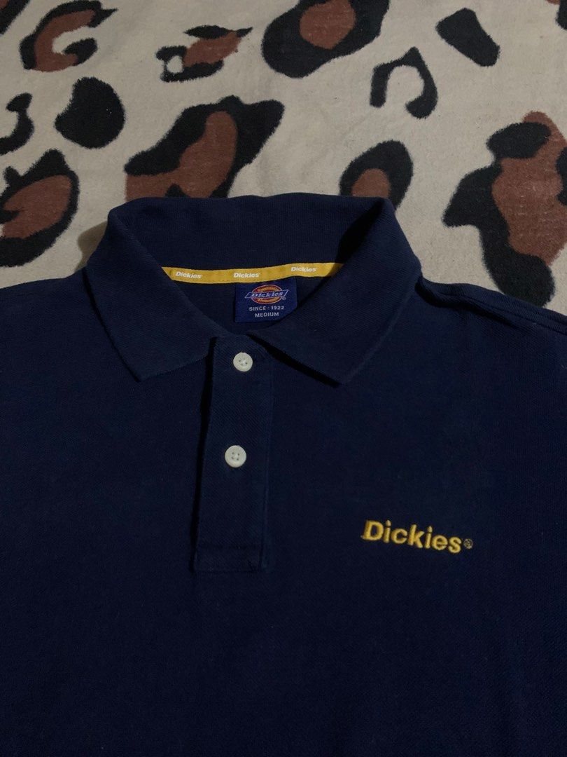 Dickies Navy Blue Polo Shirt Medium (Category: Tshirts & Polo Shirts ) located in Baguio. Submitted by ISO_PRINCE (Listing ID 1466312136, Image 2). Description: - Brand: Dickies - Color: Navy Blue - Size: Medium - Details: Yellow embroidered logo on chest, classic collar with 2 white buttons, small red woven tag near hem, yellow branded inner neckline taping - Condition: Excellent / Good as new - Style: Casual streetwear, easy to pair with jeans 