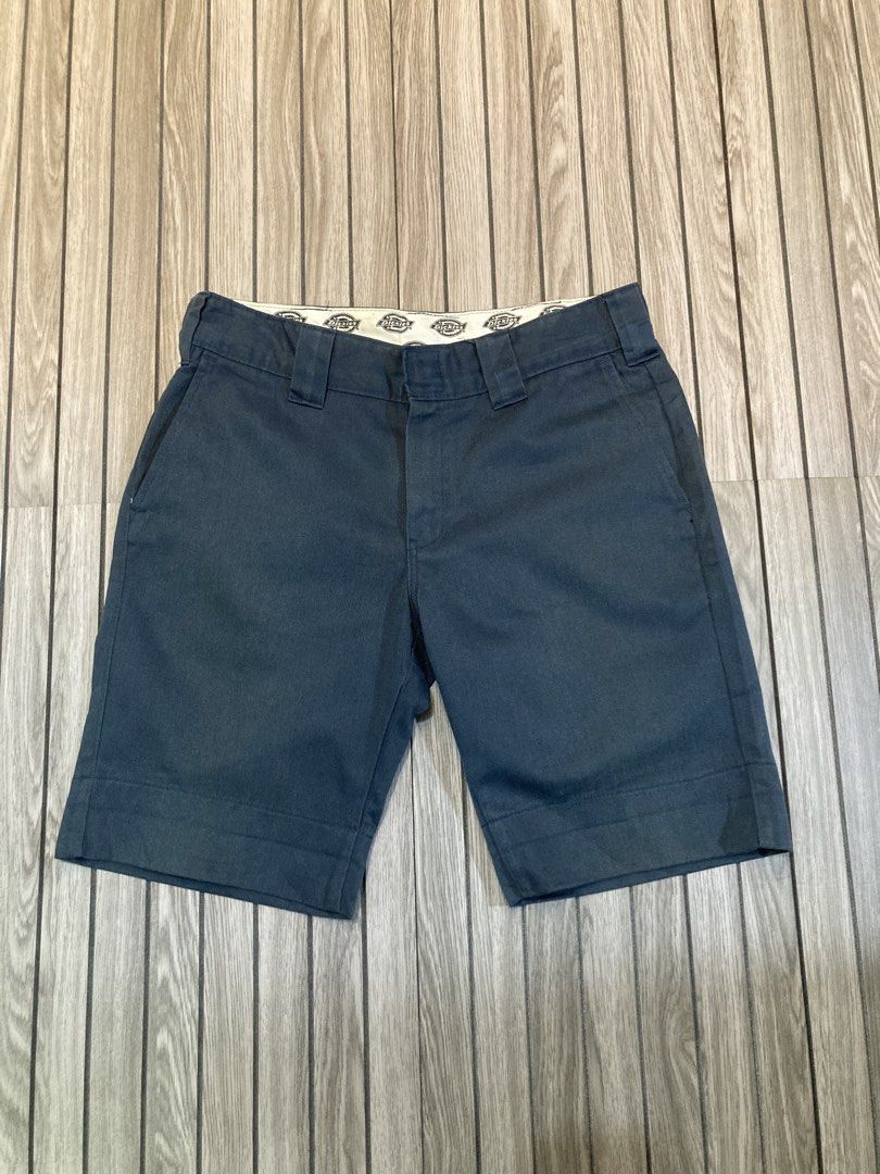Dickies Navy Blue Work Shorts (Category: Shorts) located in Trece Martires City. Submitted by thriftkoto.91 (Listing ID 1466257297, Image 3). Description: - Authentic Dickies navy blue work shorts - Classic style made with heavy-duty twill fabric - Features sturdy belt loops and a zip fly with hook and bar closure - Includes two front pockets and two back welt pockets (one with Dickies logo patch, one with button closure) - Stylish printed inner 