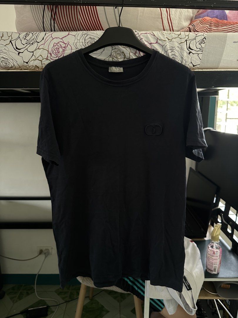 Dior CD Icon Navy Blue Shirt (Category: Tshirts & Polo Shirts ) located in Manila. Submitted by colettt1323 (Listing ID 1462511397, Image 1). Description: - Classic black crew neck t-shirt - Features a small, embroidered CD logo on the chest - Short sleeves - Ideal for casual everyday wear - Authentic.