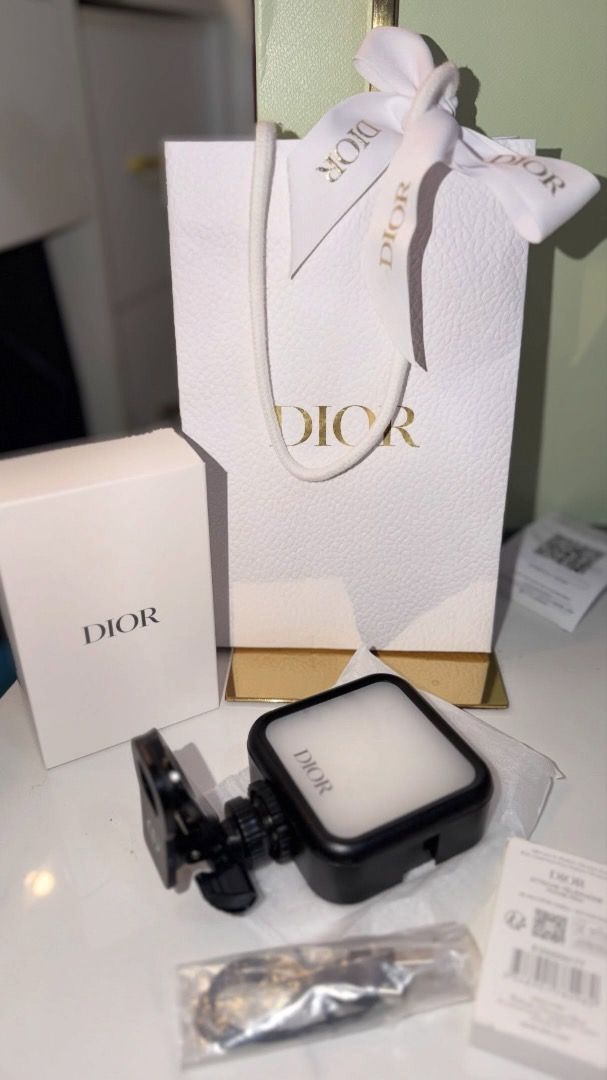 Dior Portable LED Selfie Light Clip-on Ring Light (Category: Makeup) located in Makati City. Submitted by mariaasevilla0622eb (Listing ID 1466284631, Image 1). Description: - Brand: Dior portable LED selfie light - Features: Adjustable brightness modes and color temperatures - Compatibility: Easily clips onto smartphones and other devices - Charging: Rechargeable via included USB-C cable - Packaging: Comes complete with original Dior gift box, pa