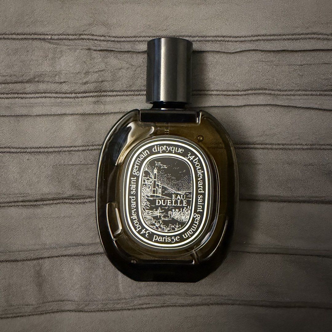 Diptyque Eau Duelle Eau de Parfum 75ml (Category: Fragrance & Deodorants) located in Manila. Submitted by vulpix04 (Listing ID 1466240999, Image 3). Description: - Brand: Diptyque - Fragrance: Eau Duelle Eau de Parfum - Size: 75ml - Condition: Like new, sprayed only a couple of times, nearly full - Scent Profile: Rich vanilla with smoky and woody notes - Inclusions: Comes with original outer box and inner sleeve - Bought in Paris - Retails for ₱1