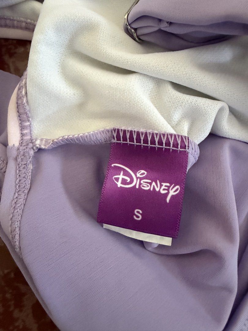 Disney Princess Sofia the First One-Piece Swimsuit Size S (Category: Bikinis & Swimsuits) located in Las Pinas. Submitted by piwiealcantara (Listing ID 1466181272, Image 3). Description: - Authentic Disney Sofia the First one-piece swimsuit - Color: Light purple with soft white inner lining - Size: S (tag attached inside) - Design: Princess Sofia front graphic print - Details: Ruffled neckline, one adjustable shoulder strap, and one ruffled strap