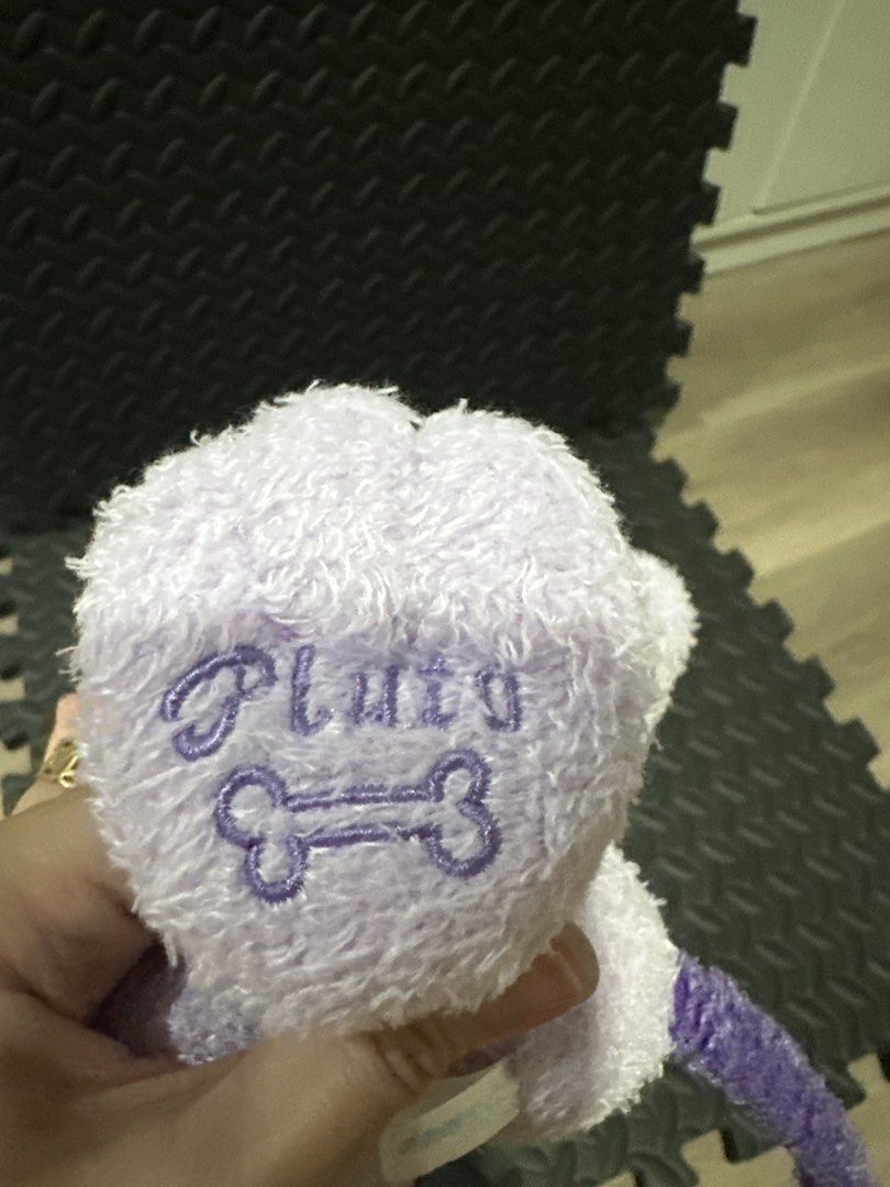 Disney Purple Pluto Dog Plush Toy (Category: Plushies & Soft Toys) located in Cainta. Submitted by shopbyyna (Listing ID 1466262463, Image 2). Description: - Official Disney Pluto plush toy in a rare purple color - Super soft, fuzzy texture with a sitting pose - Features cute embroidered Pluto name and bone graphic on the foot paw - Original tag intact (United International LTD, Made in China, Disney) - Clean fabric, very fluffy, and well-maintai