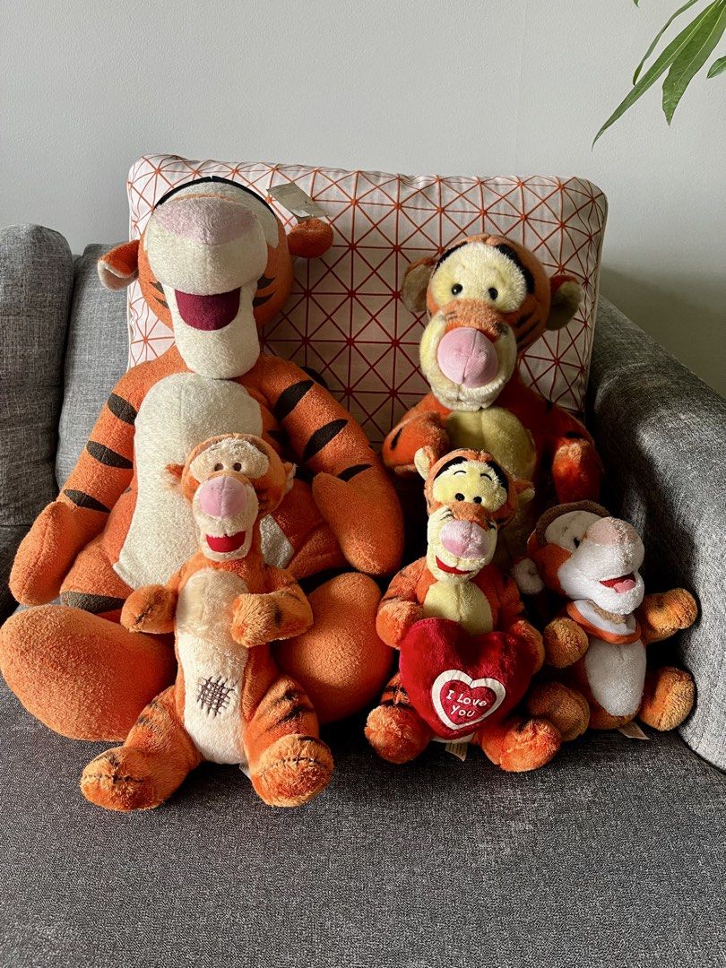 Disney Tigger Plush Toy Collection Bundle (Category: Plushies & Soft Toys) located in Manila. Submitted by lorenasant37621 (Listing ID 1466201189, Image 2). Description: - Set of 5 Disney Tigger plush toys in various sizes and poses - Includes 1 extra-large sitting Tigger, 1 large, 2 medium plushies, and 1 smaller ones - Classic orange and black stripes with cream accents - Made with soft, huggable materials - Clean overall condition, perfect for