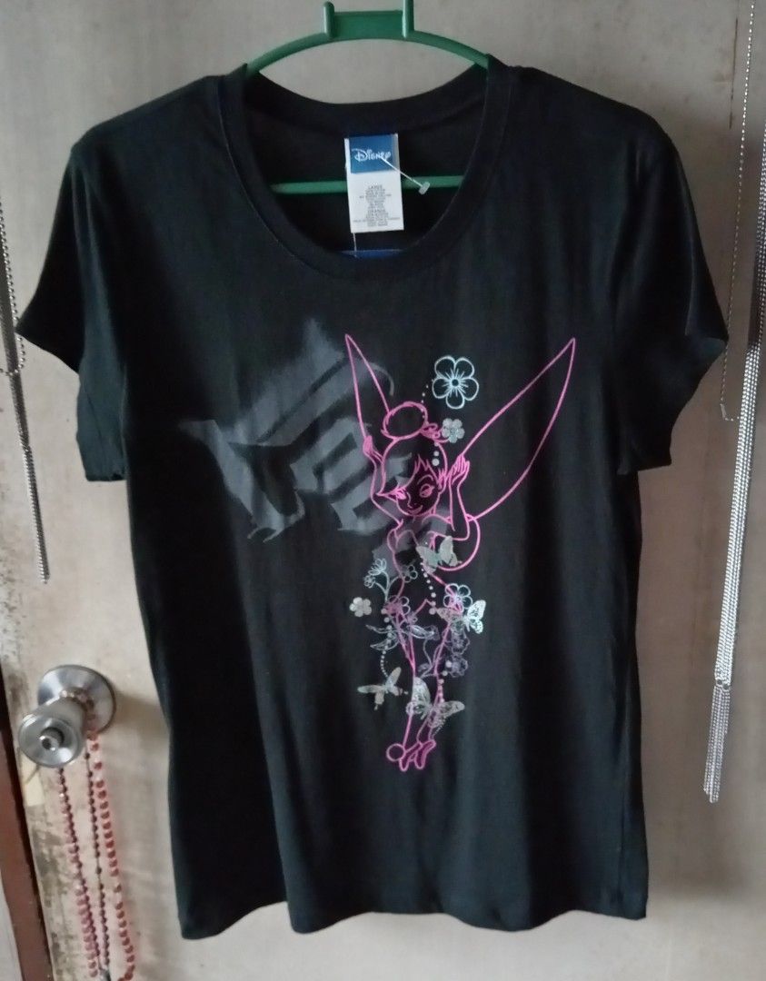 Disney Tinker Bell Black Shirt (Category: Shirts) located in Quezon City. Submitted by chacha30.s (Listing ID 1466233955, Image 1). Description: - Brand: Jerry Leigh (Made in USA) - Character: Tinker Bell with pink outline & floral details - Color: Black - Size: Large - Material: 100% Cotton - Condition: Brand new with original hang tags attached . Text me at 09277152134 . Buy na po kayo/Offer lang po kayooo.. . Bili na po/Bili na po kayo sa shop