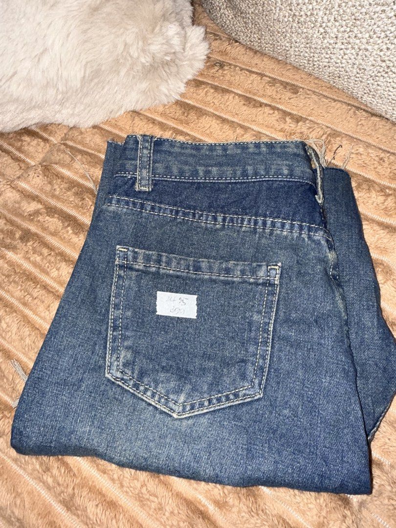Distressed Blue Denim Shorts (Category: Shorts) located in Manila. Submitted by hpshop2020 (Listing ID 1466177015, Image 3). Description: - Wash: Medium dark blue - Details: Heavy distressing on the front with raw, frayed hems - Fit/Style: Classic five-pocket design with belt loops - Closure: Button fly - Condition: Excellent pre-loved condition with back pocket sizing tag intact 200only.