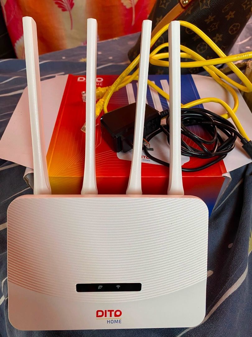 Dito Home WowFi Lite Router (Category: Networking) located in Caloocan City. Submitted by silentwind_1f8763 (Listing ID 1466166776, Image 3). Description: - Item: Dito Home WowFi Lite Wireless Router (White) - Speed: Up to 50Mbps for fast home internet - Setup: Easy configuration via the Dito app, plug-and-play design - Inclusions: 4 external antennas, power adapter, yellow ethernet cable, and original box - Condition: Complete set in original pa