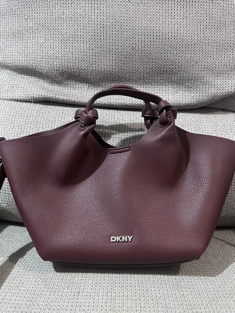 DKNY Paula Commuter Tote (Small) (Category: Cross-body Bags) located in Davao. Submitted by doc-riz (Listing ID 1466233044, Image 1). Description: ✨DKNY Paula Commuter Tote (Small) ✔️Color: Aged Wine ✔️Used once. ✔️₱2500 Swipe to see the product details, size reference when worn, and the actual price—₱7–8K in-store and online. Note: This is 100% original. 🚛Grab/J&T 💸MOP: BDO/Metrobank/Gcash/Maya/Gotyme/Maribank ⚠️No meet up. No pick up. No hagg