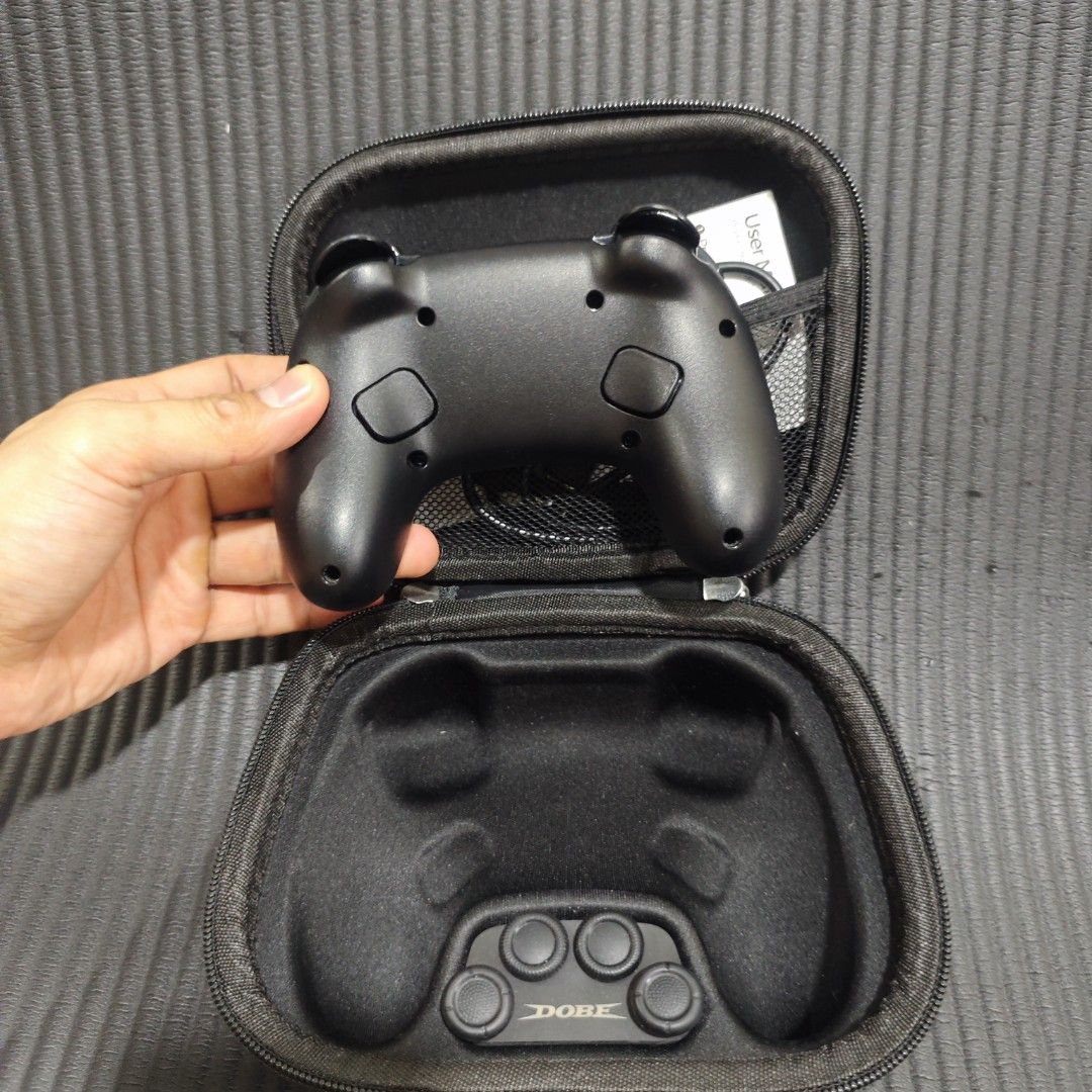 Dobe Panda Gamepad Bluetooth Controller with Bag (Category: Controllers) located in Quezon City. Submitted by shopme_gadget30 (Listing ID 1466207516, Image 2). Description: kindly read the details first for sale fixed price Good Condition tested and working no drifting all buttons working compatible to Nintendo switch v1/v2/ or oled ,pc android, ps3 with bag and charging cord qc area meet up: sm north shipping fee must shoulder by the buyer via l