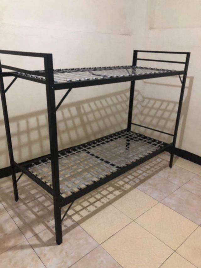 Double deck Military spring (Category: Bed Frames & Mattresses) located in Manila. Submitted by eukris (Listing ID 1466189069, Image 1). Description: - Sturdy black metal bunk bed frame - Space-saving double decker design - Durable webbed mesh base for mattress support - Ideal for dorms, shared rooms, or guest rooms - Clean and ready for pickup.