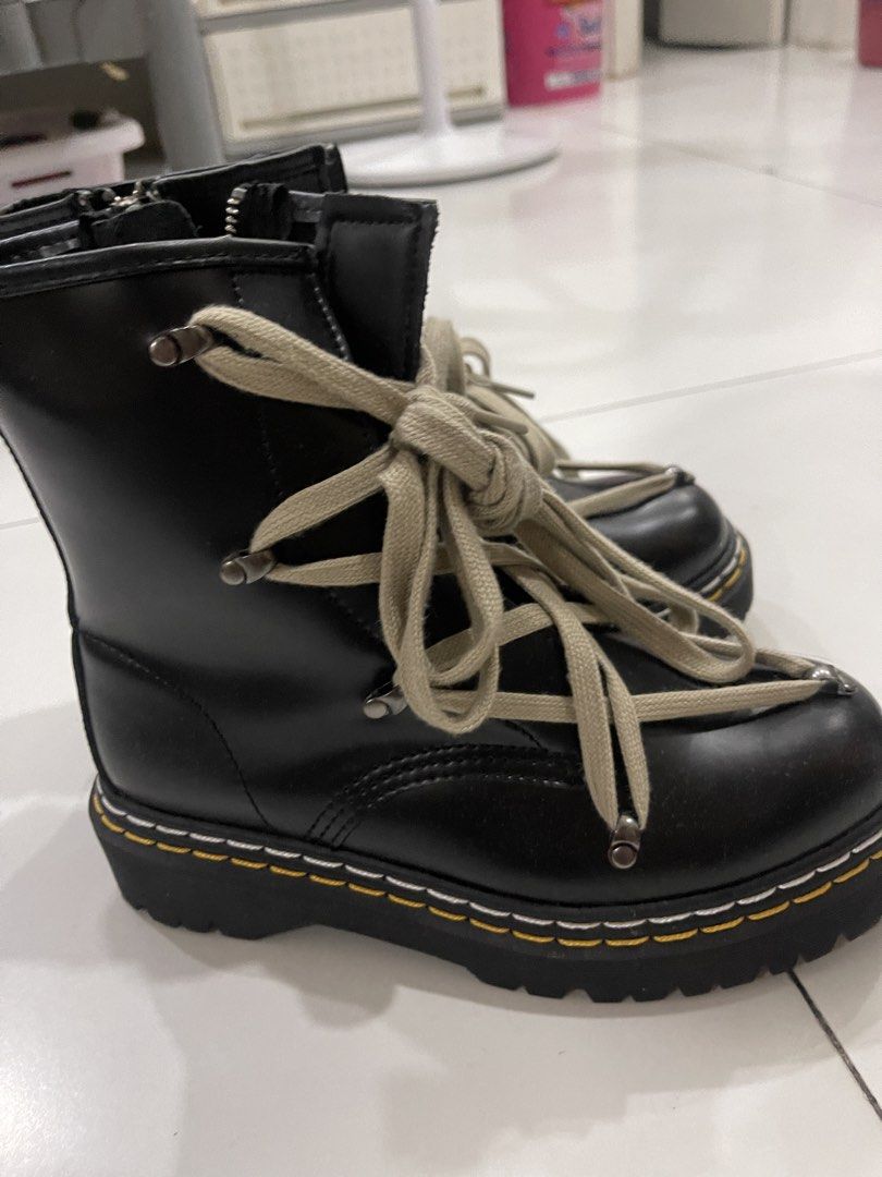 Dr. Martens Rick Owens 14xx Platform Boots (Category: Boots) located in Manila. Submitted by mariel1124 (Listing ID 1466246332, Image 3). Description: Black leather platform boots by Dr. Martens and Rick Owens collaboration. Chunky lug sole with distinctive yellow and white stitching. Extra long beige laces wrapped around the upper with metal tips. Side zipper for easy entry. Heel loop marked with Rick Owens branding..