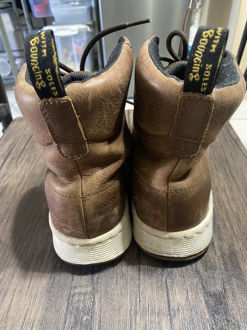Dr. Martens Rigal Brown Boots (Category: Boots) located in Quezon City. Submitted by jiujitsu_la (Listing ID 1466174740, Image 2). Description: - Brand/Model: Dr. Martens Rigal Boots - Color: Brown leather with black ankle collars and thick white soles - Size: UK 5 / US M 6 / US L 7 / EU 38 - Features: High-top design, dark brown laces, and heel pull tabs with yellow lettering - Condition: Light scuff marks on toes and soles from normal previous 