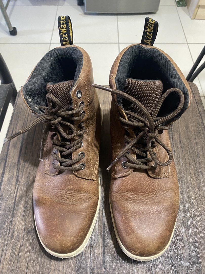 Dr. Martens Rigal Brown Boots (Category: Boots) located in Quezon City. Submitted by jiujitsu_la (Listing ID 1466174740, Image 1). Description: - Brand/Model: Dr. Martens Rigal Boots - Color: Brown leather with black ankle collars and thick white soles - Size: UK 5 / US M 6 / US L 7 / EU 38 - Features: High-top design, dark brown laces, and heel pull tabs with yellow lettering - Condition: Light scuff marks on toes and soles from normal previous 