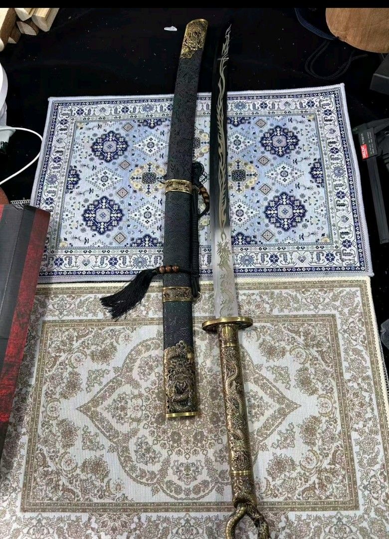 Dragon ring sword (Category: Vintage Collectibles) located in San Rafael. Submitted by jflshoppe1989 (Listing ID 1466266914, Image 1). Description: Real dragon katana sword *40 inches lenght *2kilo ang bigat ng sword nya * Brass ang kanyan handle * Mga nka embose ang details nya *Reel steel blade *Maganda hindi ka mgsisi *Good for collection Price 9500 plus shipping Mas ok Lalamove pick up Contact number 09976703787.